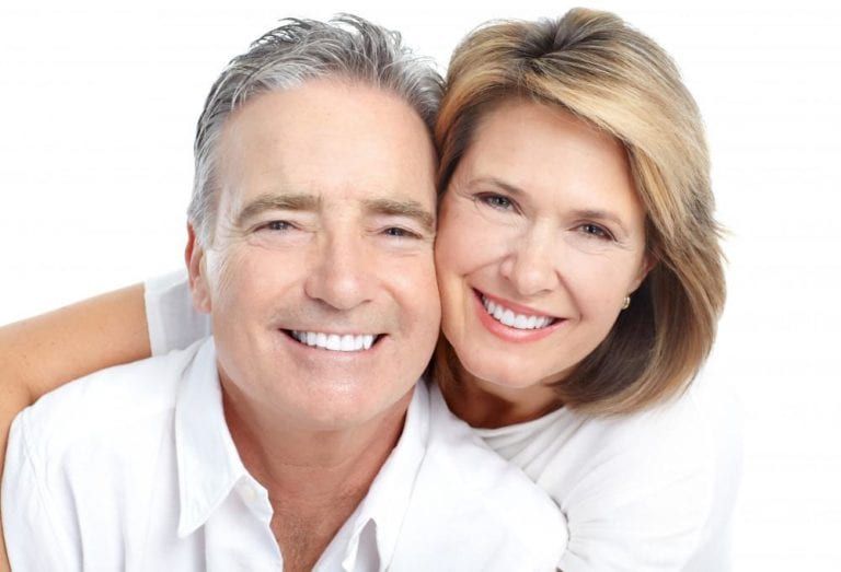 man and woman smiling white background